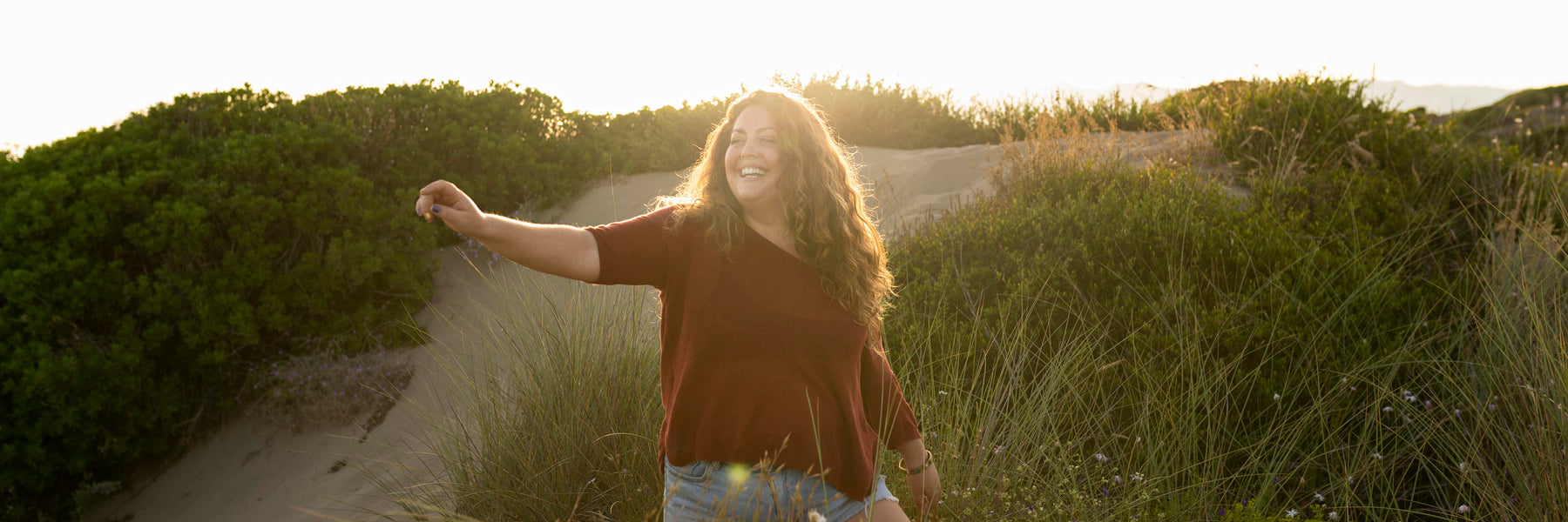 Woman enjoying a sunny walk in nature